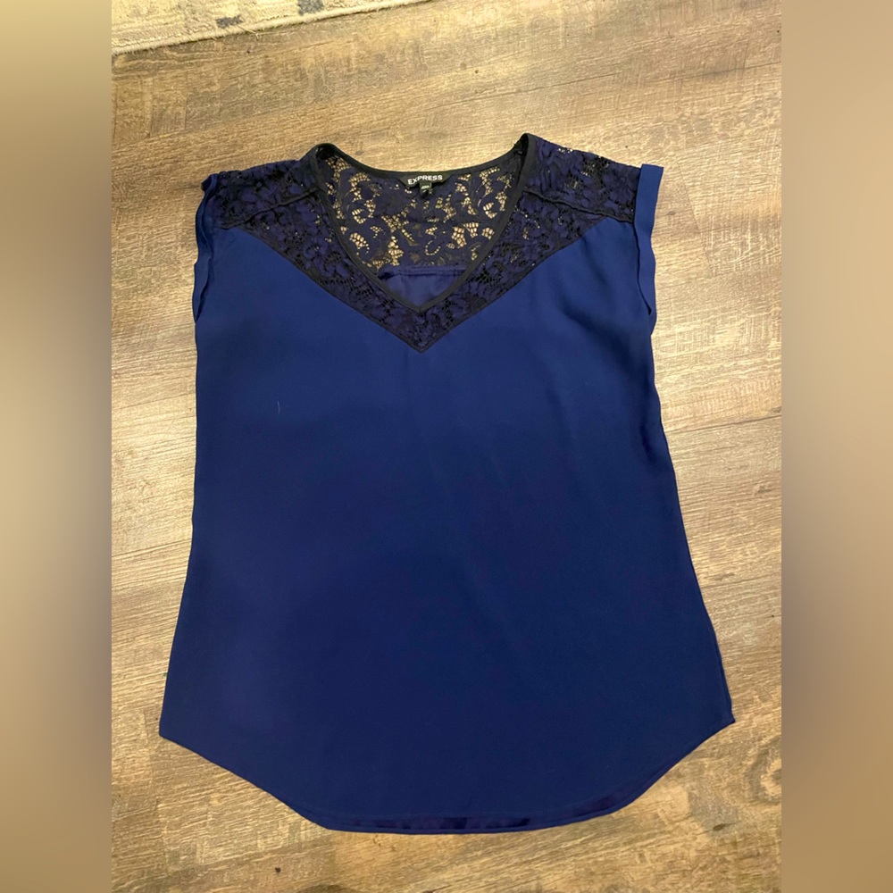Navy silk blouse with black lace covering the shoulder